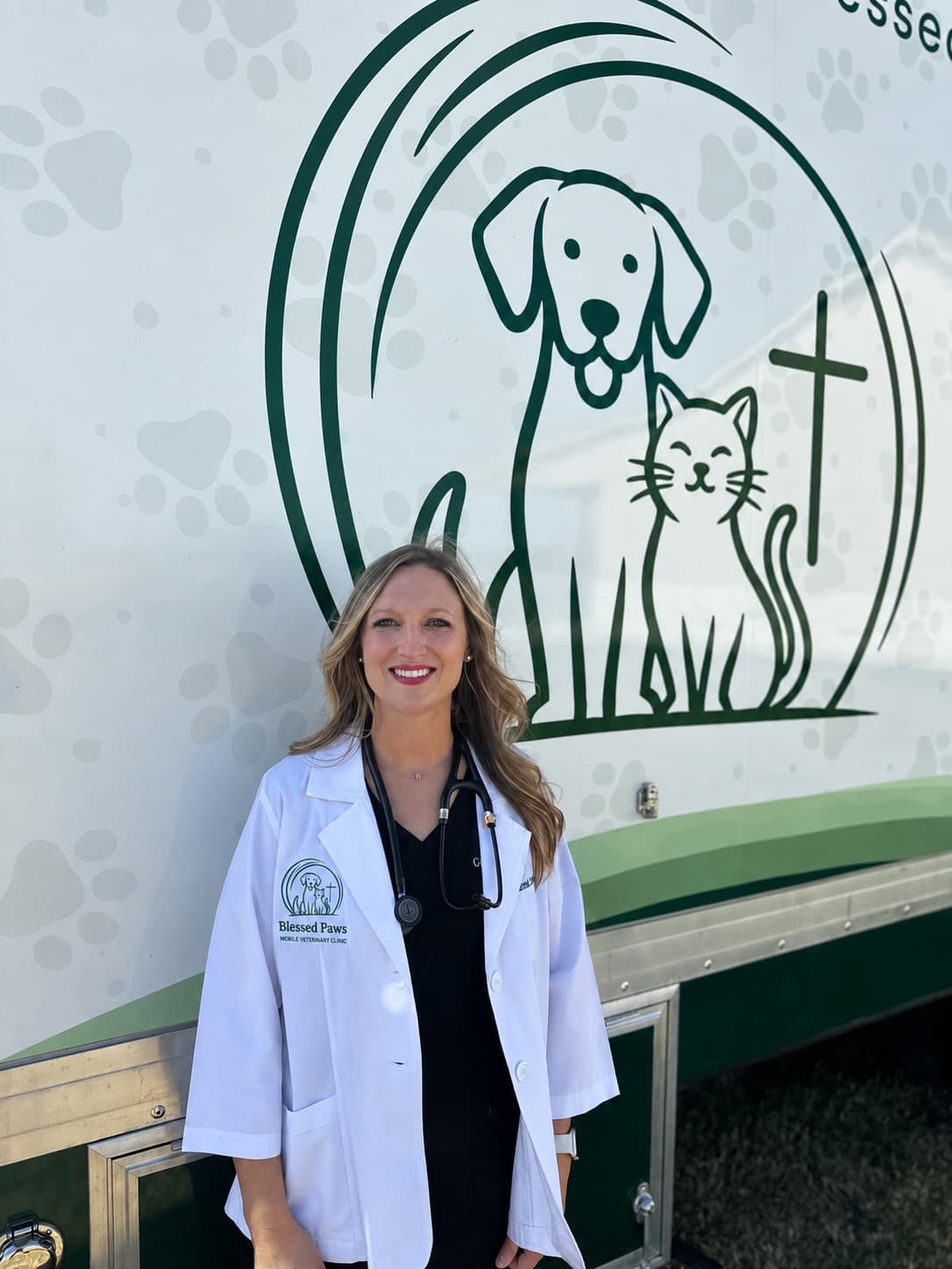Blessed Paws veterinarian beside the mobile veterinary clinic serving central Oklahoma